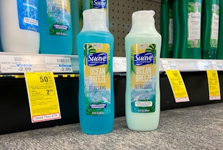 2 bottles of suave essentials ocean breeze shampoo and conditioner on CVS floor next to sale tag