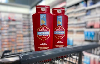 two bottles of old spice champion body wash in a walgreens cart