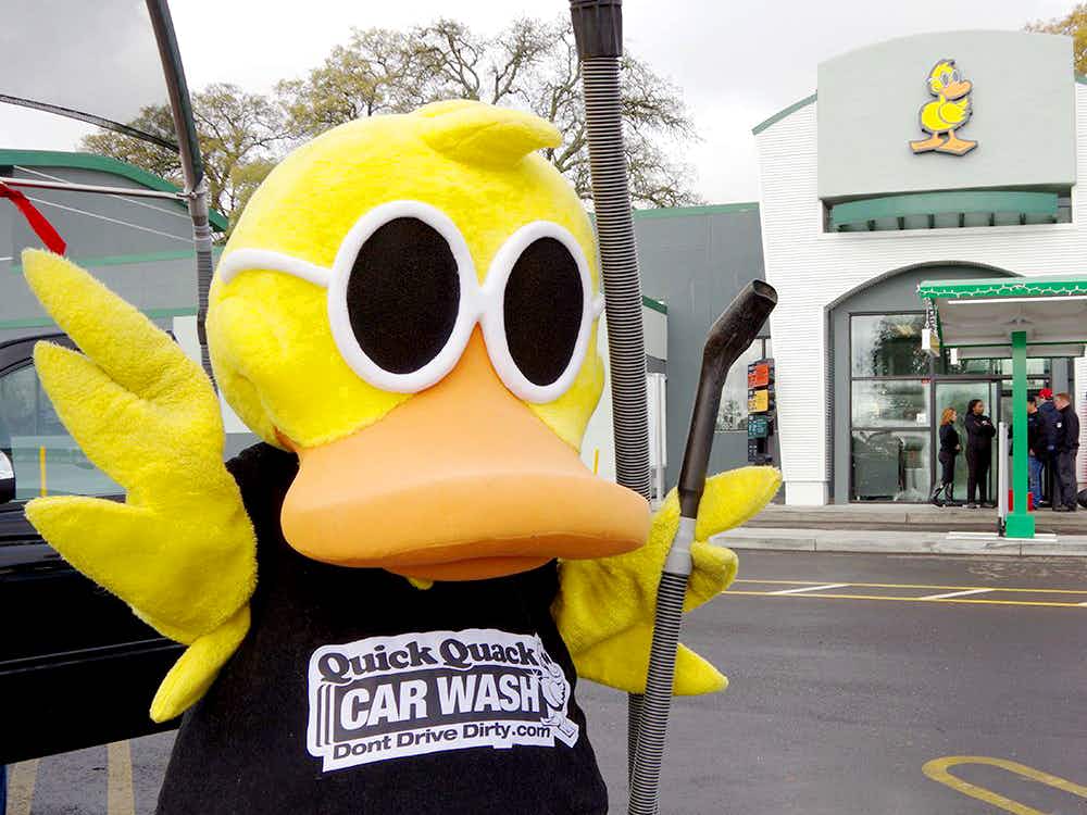 Quick Quack Car Wash mascot with vacuum