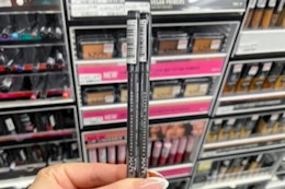 hand holding two nyx lip liners