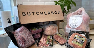 butcherbox delivery box in kitchen with various cuts of meat
