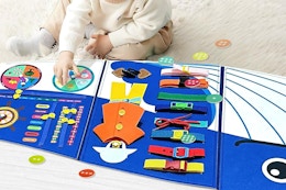 a baby using a busyboard