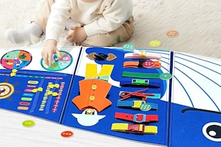 a baby using a busyboard