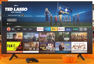 A 4K Amazon Fire TV on a mostly orange background.
