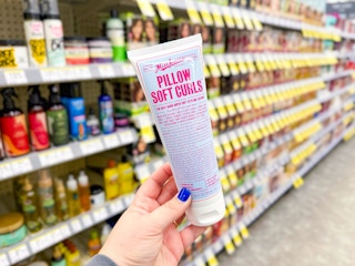 hand holding miss jessie's pillow soft curls in walgreens