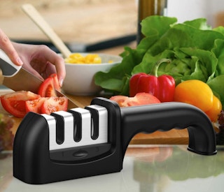 A knife sharpener in front of food.