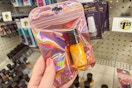 hand holding sally hansen nail polish at dollar tree