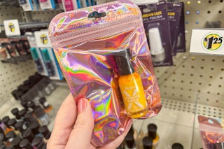 hand holding sally hansen nail polish at dollar tree