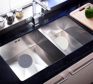 a sink with drain stoppers