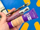 hand holding a Rimmel lip, eye, and face makeup container