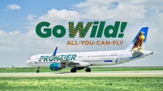 A Frontier Airlines plane on a tarmac with the GoWild All-You-Can-Fly pass logo above it