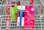 maybelline and covergirl mascaras in a cart with a one+other eyelash curler