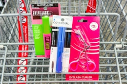 maybelline and covergirl mascaras in a cart with a one+other eyelash curler