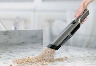 hand holding the Shark handheld vacuum