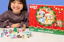 a girl with a bluey advent calendar