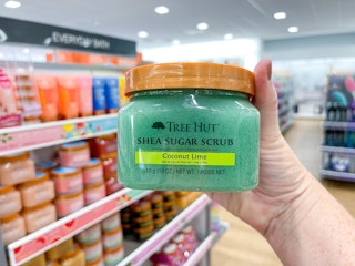 tree hut sugar scrub being held