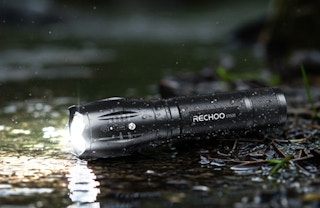 a flashlight on the ground outside