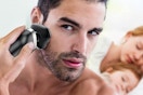 a man using an electric shaver