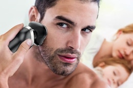 a man using an electric shaver