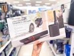 hand holding a sharper image hand vac in a target aisle