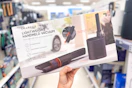 hand holding a sharper image cordless hand vac in a target aisle