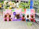 3 Air Wick Products in Walmart shopping cart in front of flowers