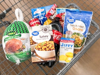 A Walmart shopping cart full of groceries needed to make dishes for a Thanksgiving meal.