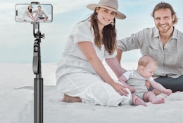 a family using a selfie stick to take a picture