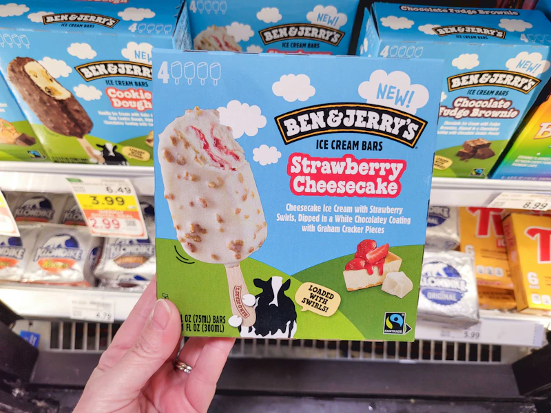 hand holding a box of ben jerry ice cream bars
