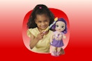 Girl playing with My Little Pony Baby Alive doll (playing with her hair)