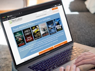 Someone looking at the Net Galley website on a laptop
