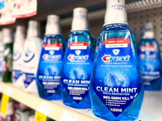 crest mouthwash bottles on a store shelf