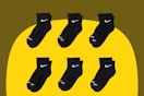 Six pairs of ankle socks for little kids or large-footed toddlers, black with white Nike swish