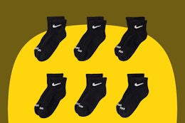 Six pairs of ankle socks for little kids or large-footed toddlers, black with white Nike swish
