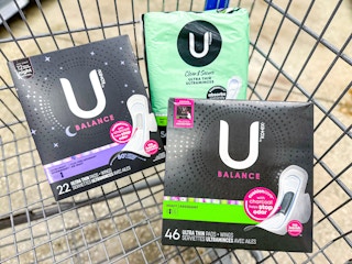 three packages of U by Kotex pads and liners