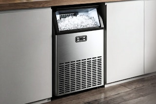Lifestyle image of the Simzlife Freestanding Ice Machine installed in home kitchen