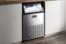 Lifestyle image of the Simzlife Freestanding Ice Machine installed in home kitchen
