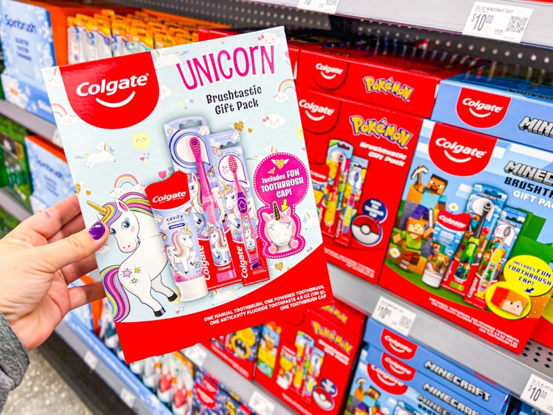 hand holding colgate kids gift set in walmart aisle