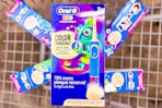 kids electric toothbrush in a cart on top of toothpaste boxes