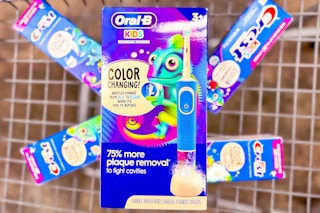 kids electric toothbrush in a cart on top of toothpaste boxes