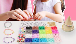 a mom and daughter making bracelets with a bracelet kit