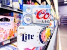 Coors Light and Miller Lite Beer 12-count boxes in beer aisle of Walmart store