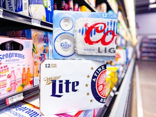 Coors Light and Miller Lite Beer 12-count boxes in beer aisle of Walmart store