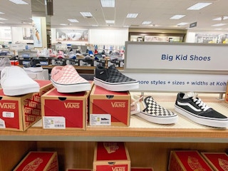 kids vans shoes on shelf