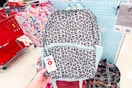 hand grabbing a dealworthy backpack off a target shelf