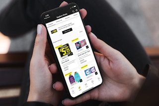 a person looking at the dollar general app on their iphone