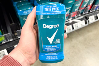 hand holding degree deodorant in walmart aisle