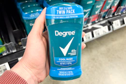 hand holding degree deodorant in walmart aisle