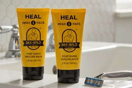 two bottles of Bee Bald post-shave healing balm