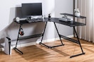 Lifestyle image of X Rocker L-Shaped Gaming Desk in bedroom setting